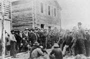 Miners wait to register their claims.